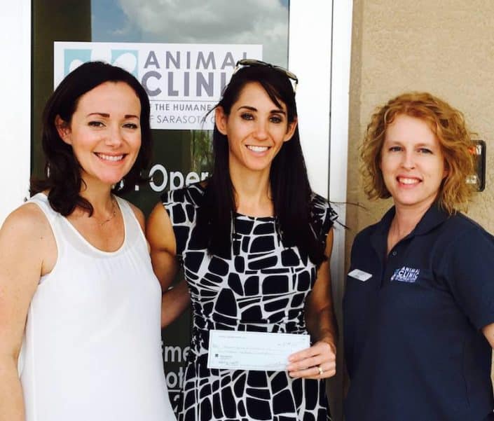 Smile Sarasota giving to the Humane Society of Sarasota County